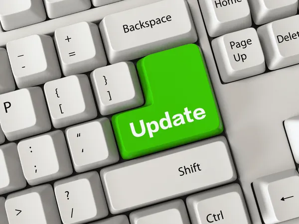 Een groene updateknop op een computertoetsenbord.